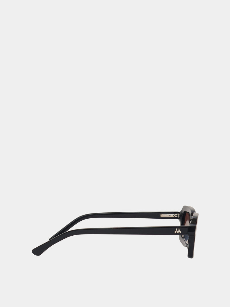 Rectangle shaped sunglasses in a black plastic colour with a brown lens. 