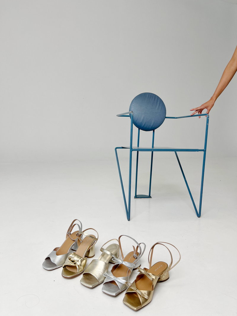 Wedding collection of shoes and a blue chair