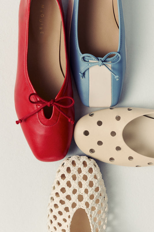 four different ballet flats on white background